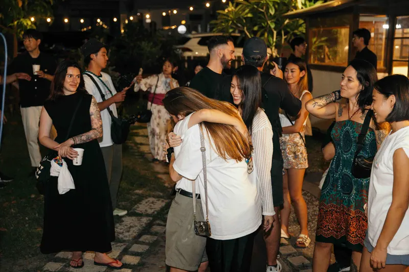 Two guests hug goodbye after meeting at Taiwan Digital Night